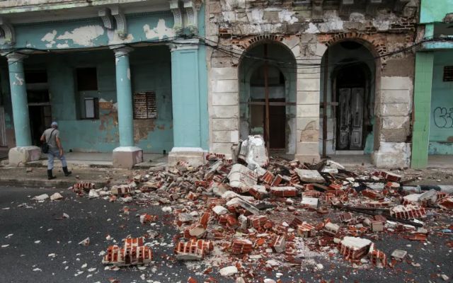 Debris from a building damaged by the passage of Hurricane Rafael 